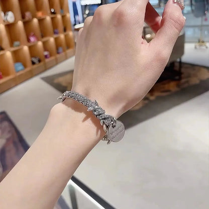 Barbed Coin Charm Bracelet