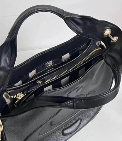 Curved Saturn Leather Bag