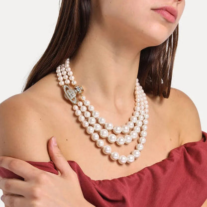 Regal Triple Strand Pearl Necklace with Embellished Orb Accent