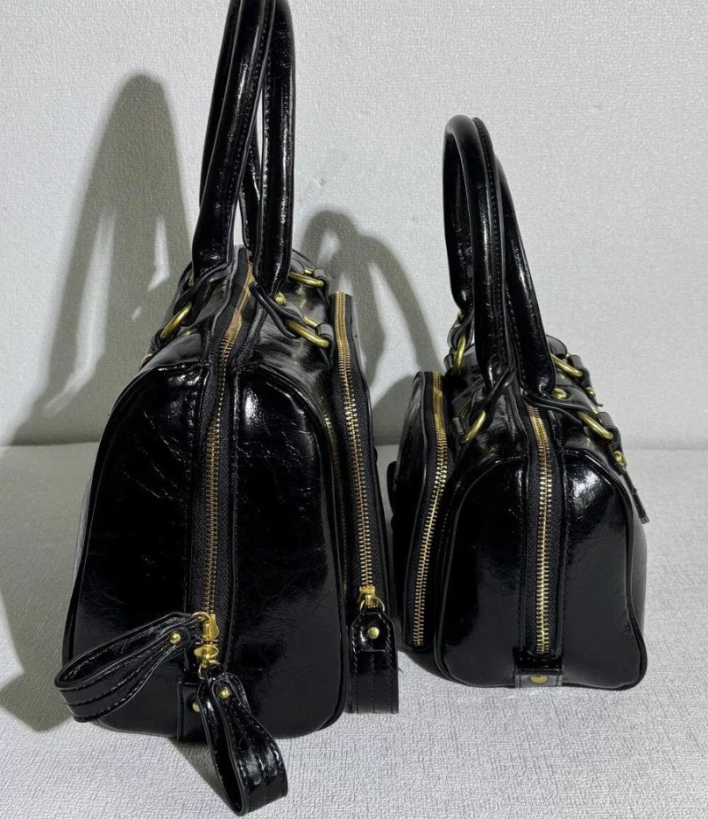 Structured Leather Boston Bag with Saturn Emblem