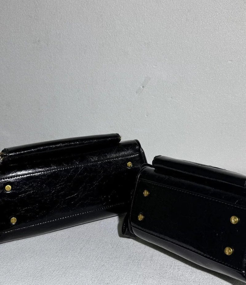 Structured Leather Boston Bag with Saturn Emblem