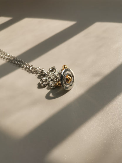 Silver and gold bow orb necklace (with box)
